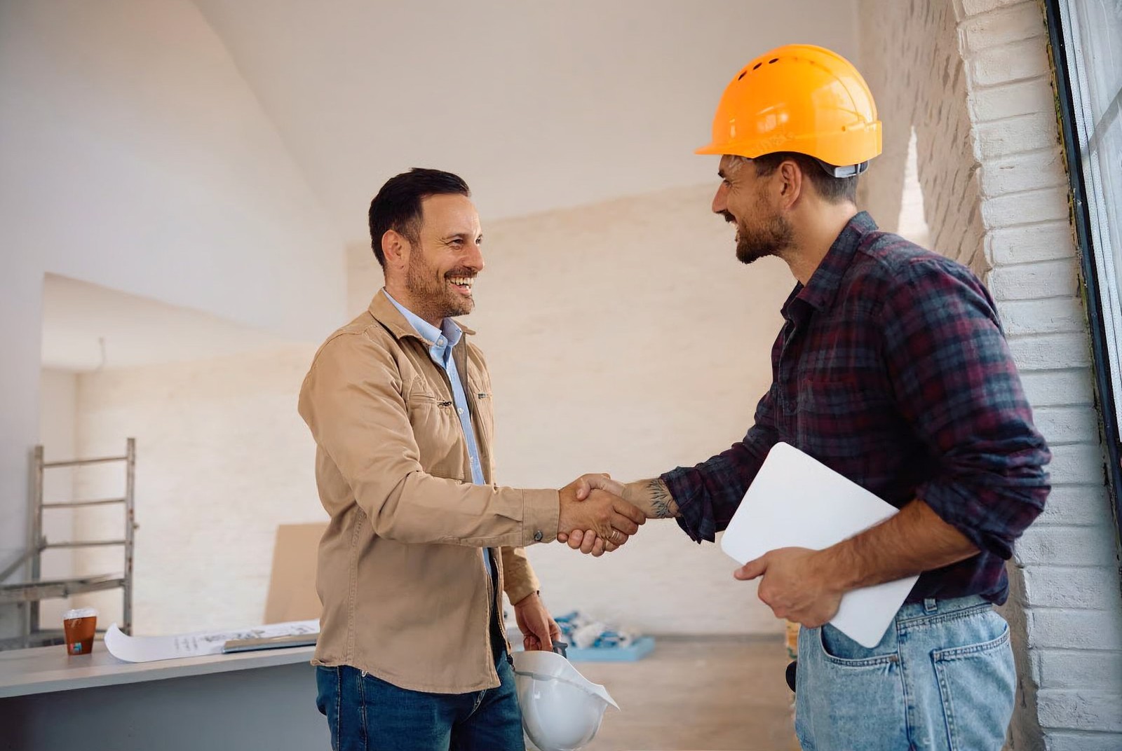 Ironside meeting a tradesman on site and shaking hands